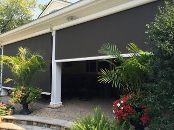 Exterior Solar Shade Encloses a Patio - blocking the sun but not the view